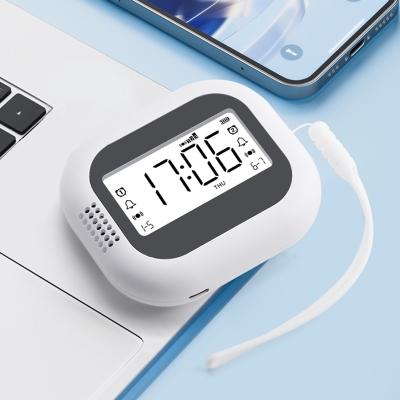 FM radio vibrating clock with snooze function and rechargeable battery for travelers